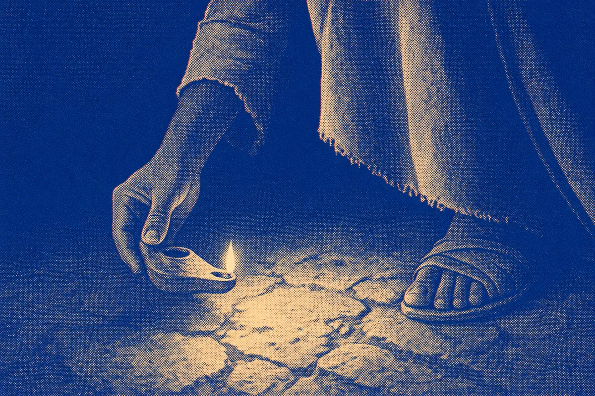 A hand holding a lamp aloft
